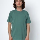 Man wearing a green t-shirt against a white background