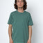 Man wearing a green t-shirt against a white background