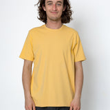 Person wearing a yellow t-shirt against a white background