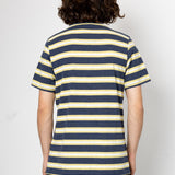 Person wearing a navy and yellow striped shirt against a white background