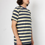 Man wearing a navy and yellow striped shirt against a white background