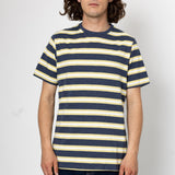 Person wearing a navy and yellow striped t-shirt against a white background