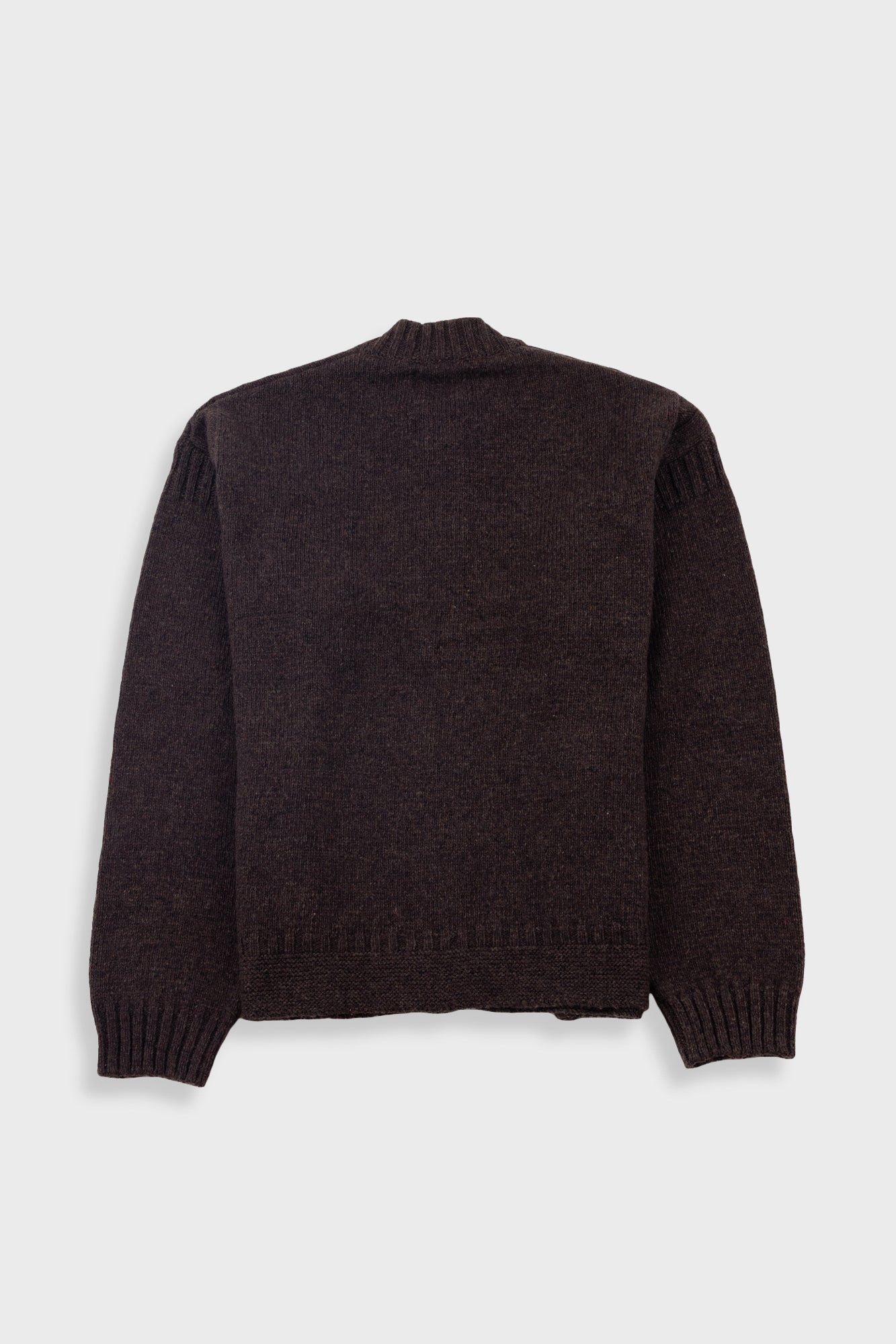 Dark brown sweater on a light gray background