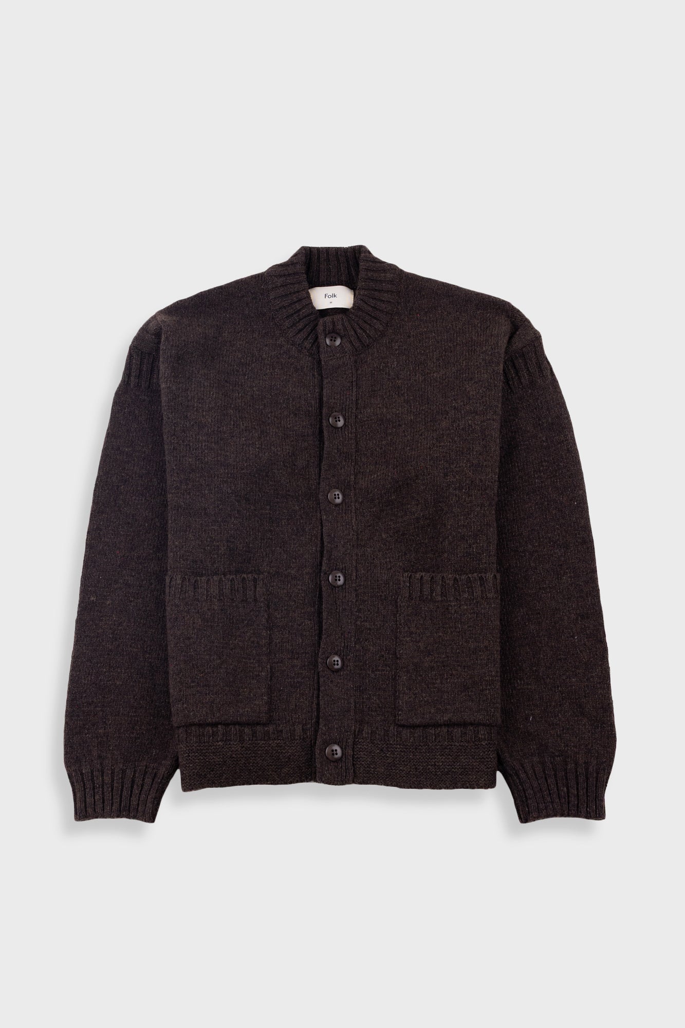 Dark brown cardigan on a light gray background
