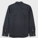 Dark grey flannel shirt against a white backdrop