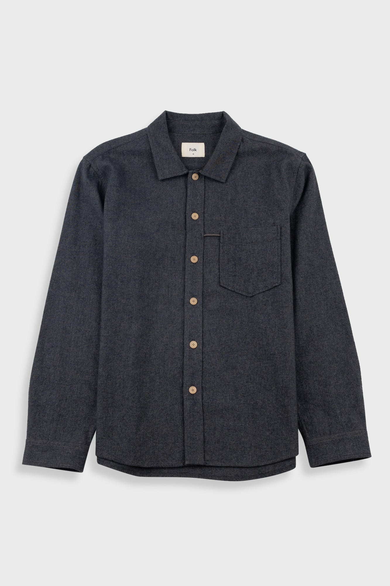A dark charcoal gray long-sleeve button-up shirt jacket with a single chest pocket, laid flat against a light gray background.
