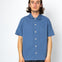 Man wearing blue shirt against a white background