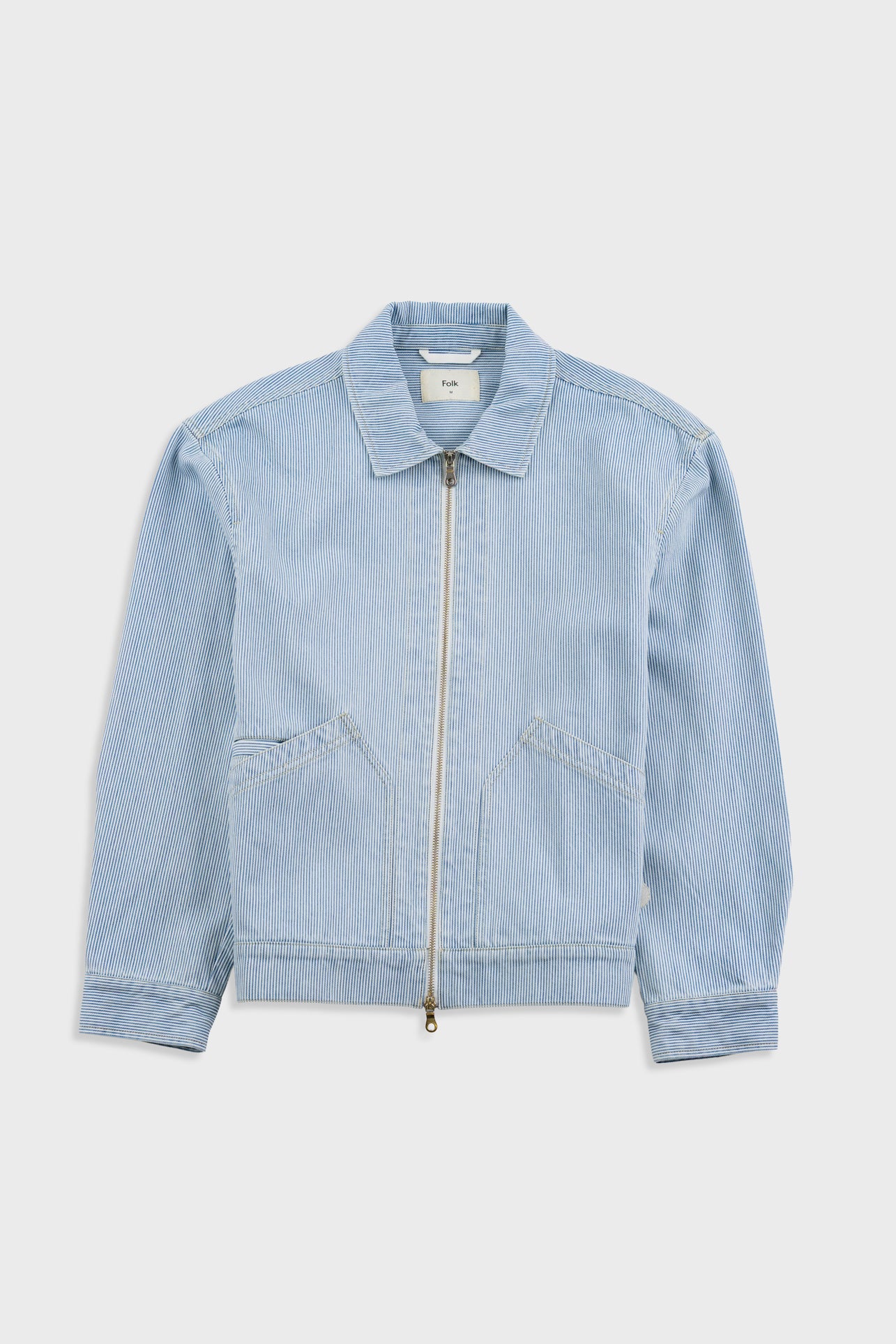 Light blue denim jacket on a white background