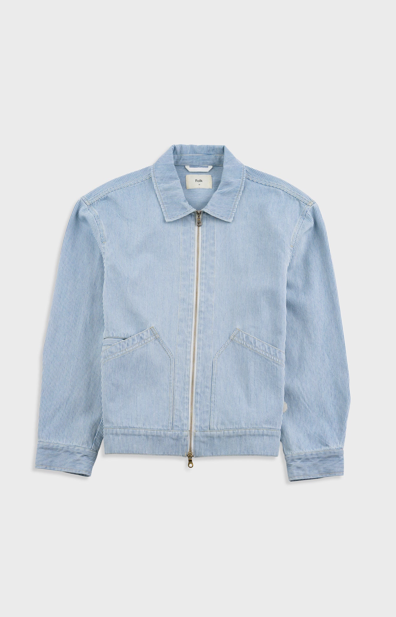Light blue denim jacket on a white background