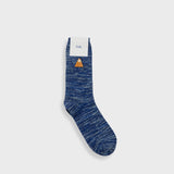 A single blue marled crew sock with a small orange and white mountain graphic near the cuff, shown against a light gray background.