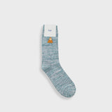 A single light blue and gray marled crew sock with a small yellow duck graphic and the brand name 'Fush' printed on the white cuff, shown against a light gray background.