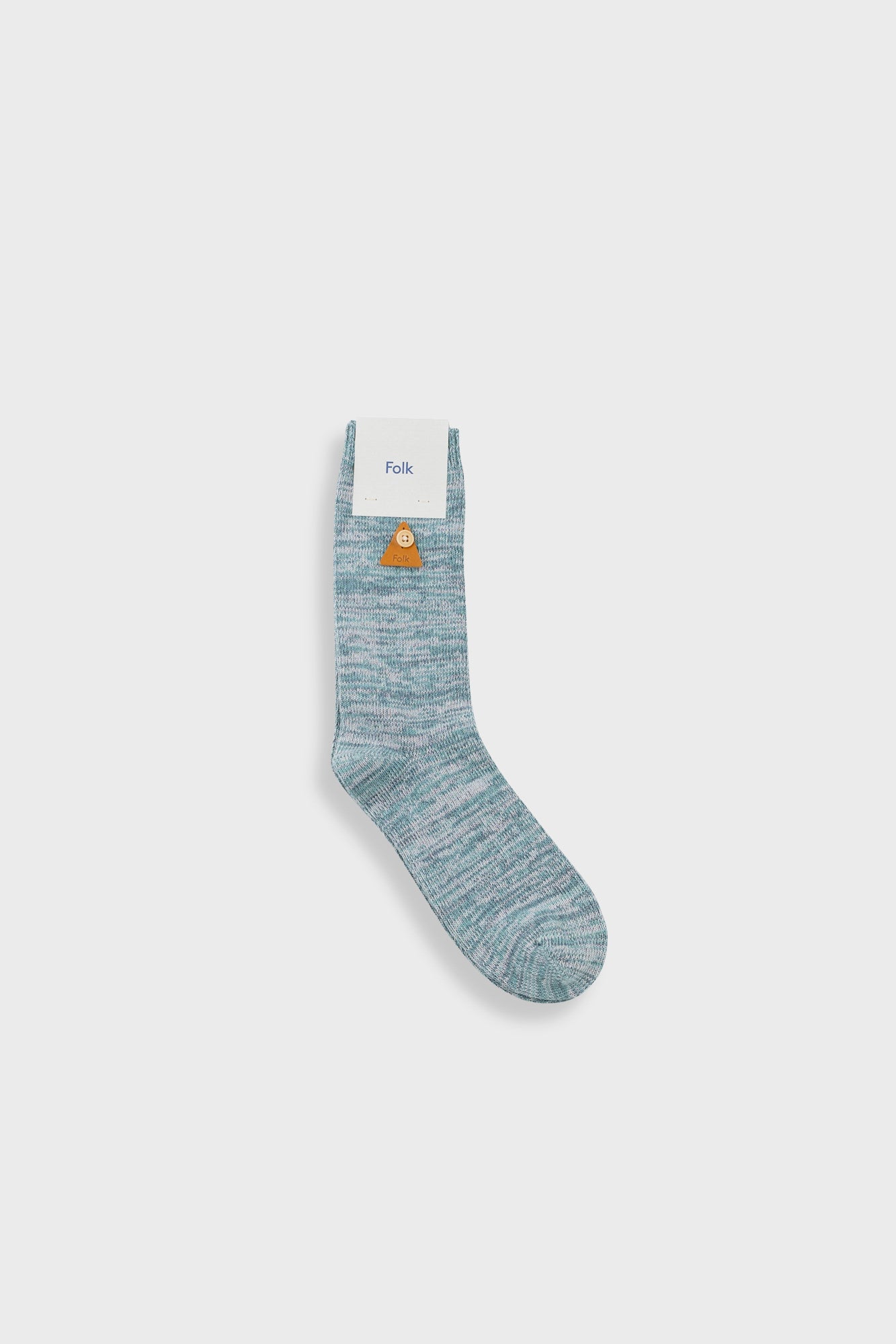 A single light blue and gray marled crew sock with a small yellow duck graphic and the brand name 'Fush' printed on the white cuff, shown against a light gray background.