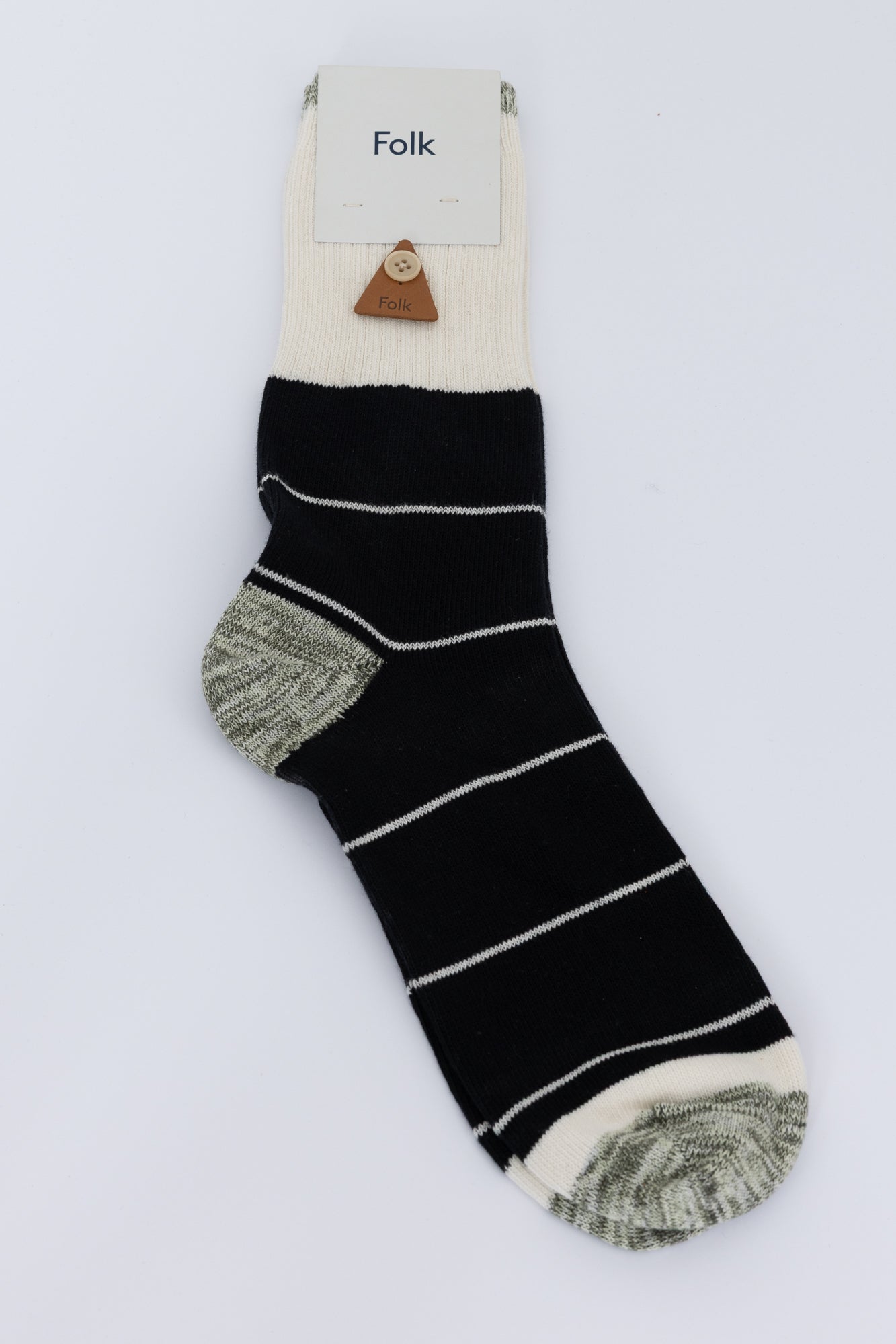 Black striped socks against a grey backgound