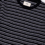 Black and white striped shirt with a visible brand label on a white background