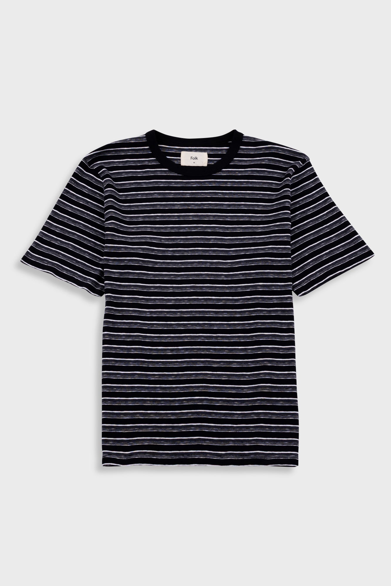 Black and white striped t-shirt on a light gray background