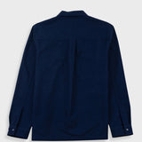 A dark navy blue long-sleeve button-up shirt shown from the back, laid flat against a light gray background.