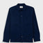 Navy overshirt with a visible brand label on a light gray background