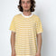 Person wearing a yellow and white striped t-shirt against a white background