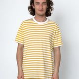 Man wearing a yellow and white striped t-shirt against a white background