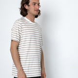 Man wearing a striped shirt against a white background