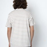 Person wearing a striped shirt from behind on a white background