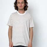 Man wearing a striped t-shirt against a white background