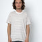 Man wearing a striped t-shirt against a white background