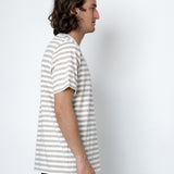 Person wearing a striped shirt against a white background