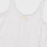 White ribbed tank top with a brand label on a white background