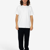 Person wearing a white t-shirt and black pants on a white background