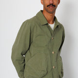 Man wearing a green jacket with a white background