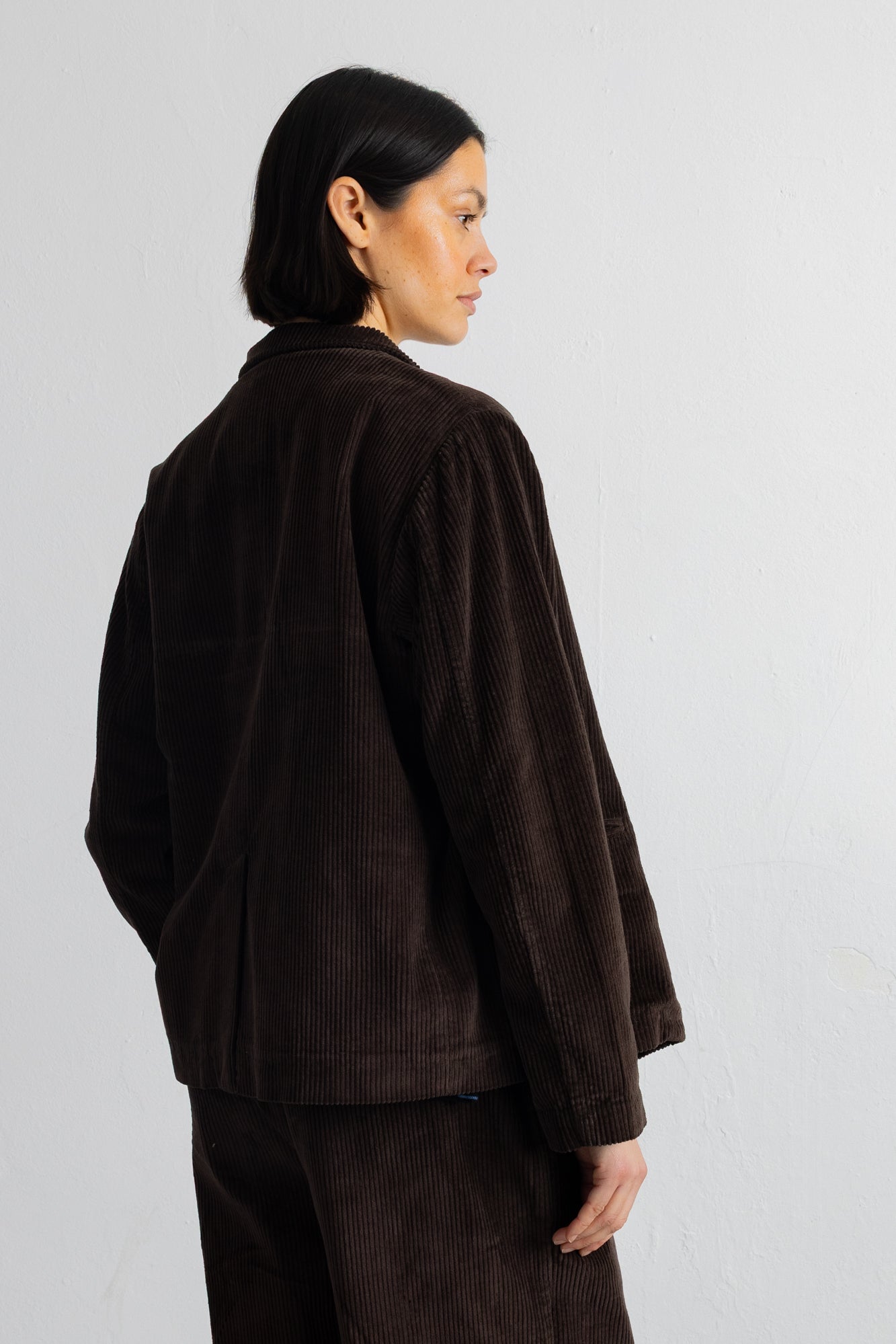 Model wearing a corduroy blazer and matching trousers