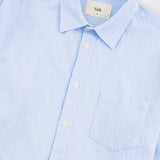 Light blue checkered shirt with 'Folk' label on a white background