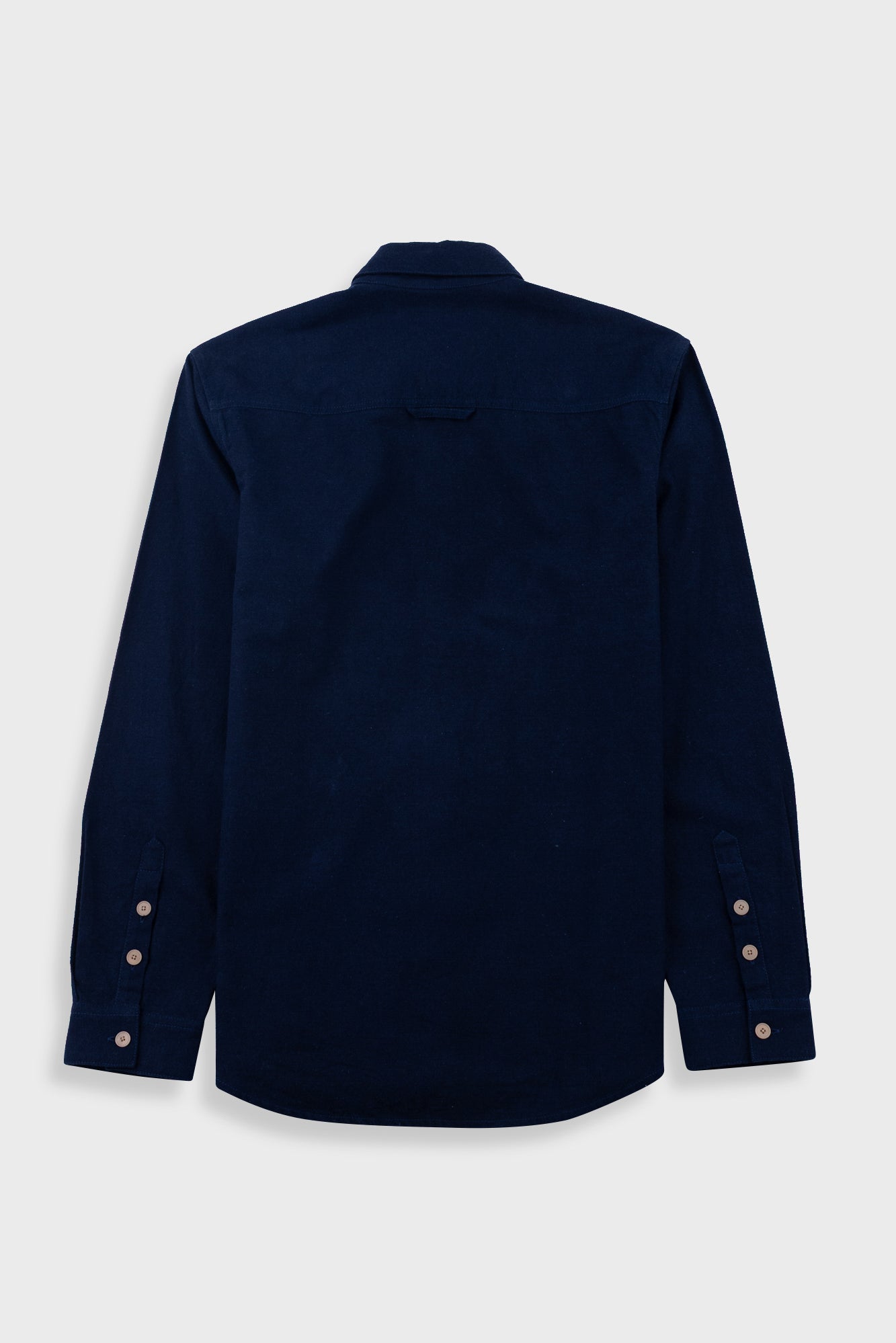 A dark navy blue long-sleeve button-down shirt shown from the back, featuring a pointed collar and three decorative buttons on each cuff, displayed against a light gray background.