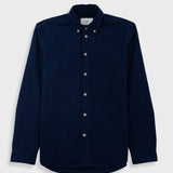 Blue shirt on a light gray background