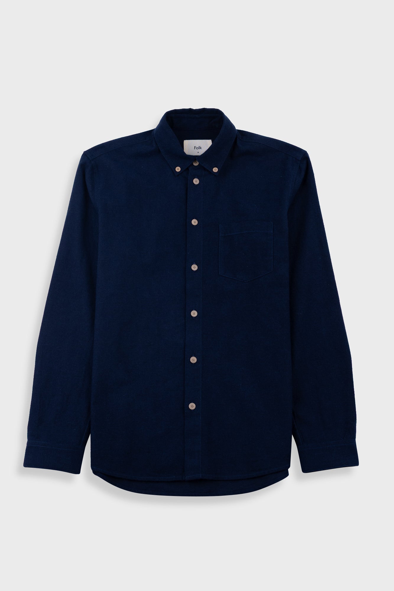 Blue shirt on a light gray background
