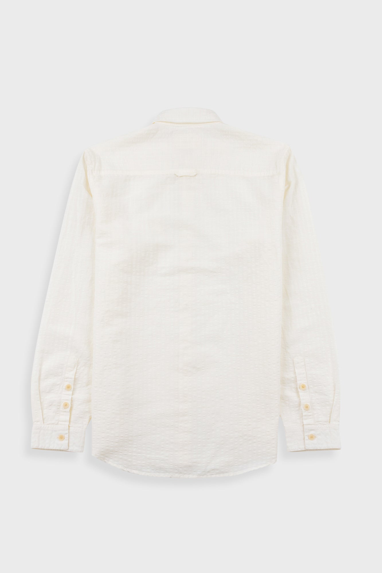 White button-up shirt on a light gray background