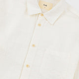 White shirt with yellow buttons on a white background