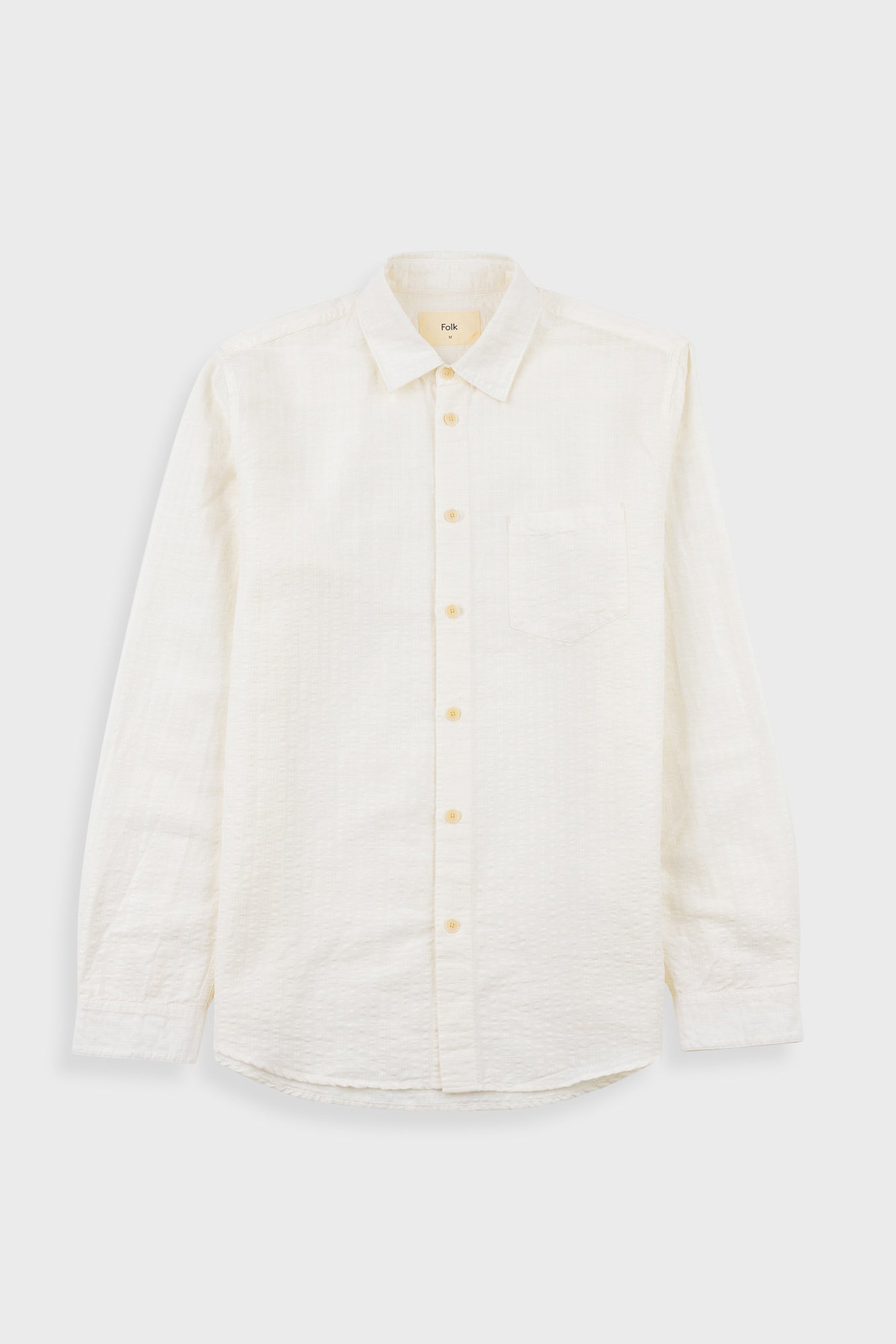White button-up shirt on a white background