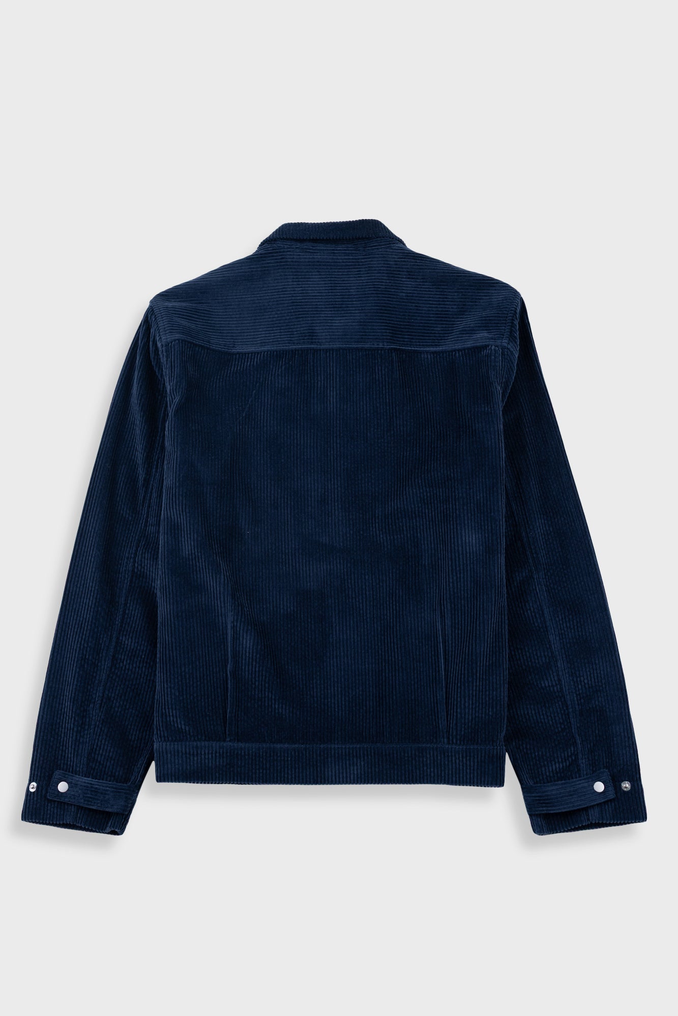 A dark navy blue corduroy jacket shown from the back, featuring a classic collar and buttoned cuffs, displayed against a light gray background.