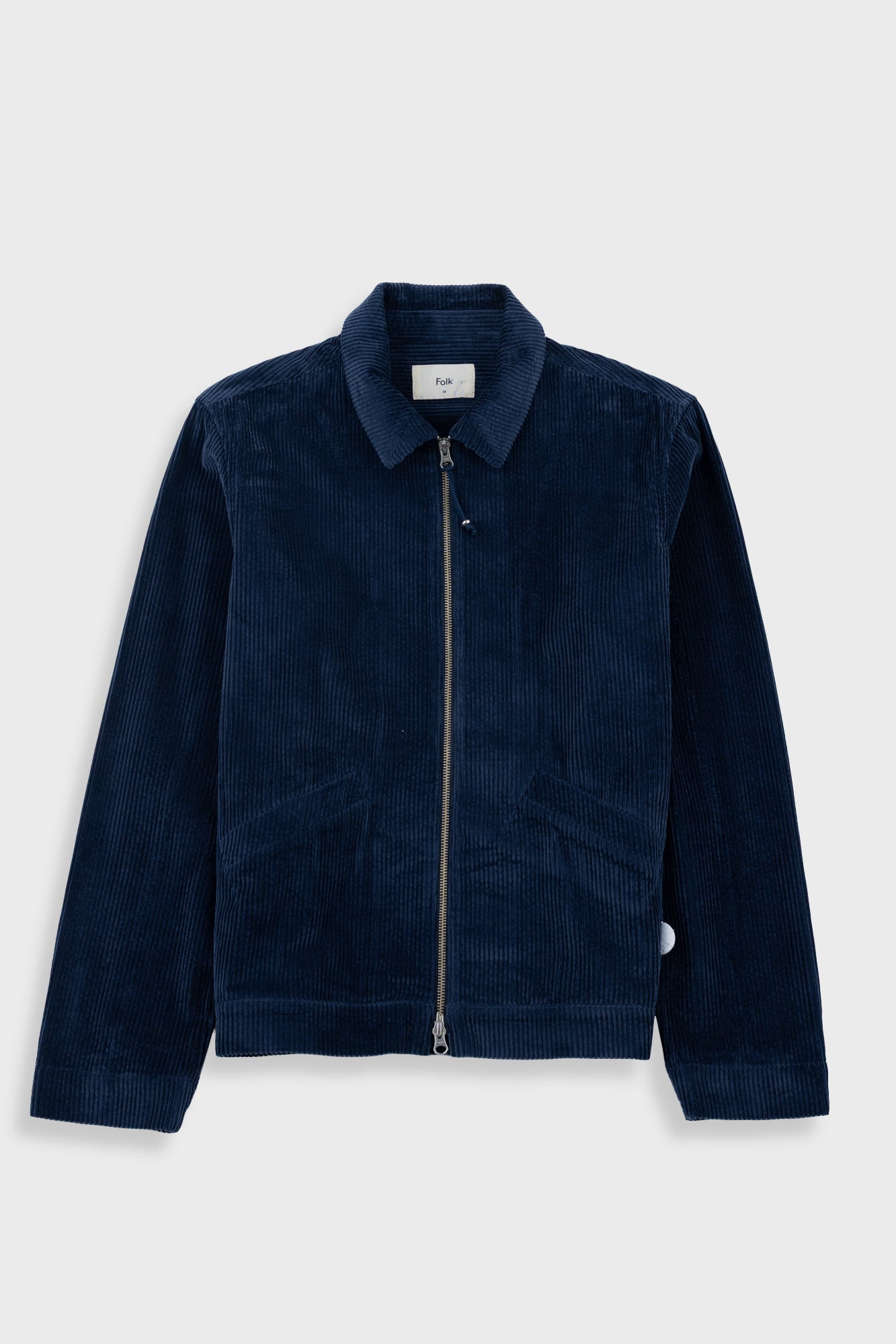 A dark navy blue corduroy jacket with a front zipper, collar, and front pockets, displayed against a light gray background.