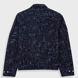 Dark blue patterned jacket on a light gray background