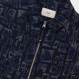 Navy patterned jacket with a visible brand label on a white background