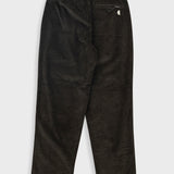 Black corduroy pants on a white background