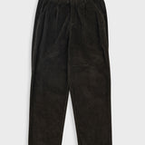 Dark brown corduroy pants on a light gray background