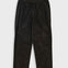 Dark brown corduroy pants on a light gray background