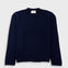 Navy blue sweater with a visible brand label on a white background