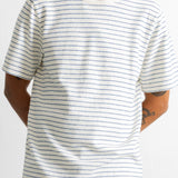 A man wearing a white short-sleeve crewneck t-shirt with thin blue horizontal stripes, paired with blue jeans, shown from the neck down against a plain white background.