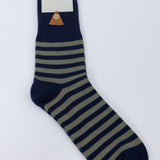 Navy and beige striped sock with 'Folk' label on a white background