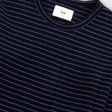 Close-up of a dark navy blue striped crewneck t-shirt with a white neck label reading 'Folk'.